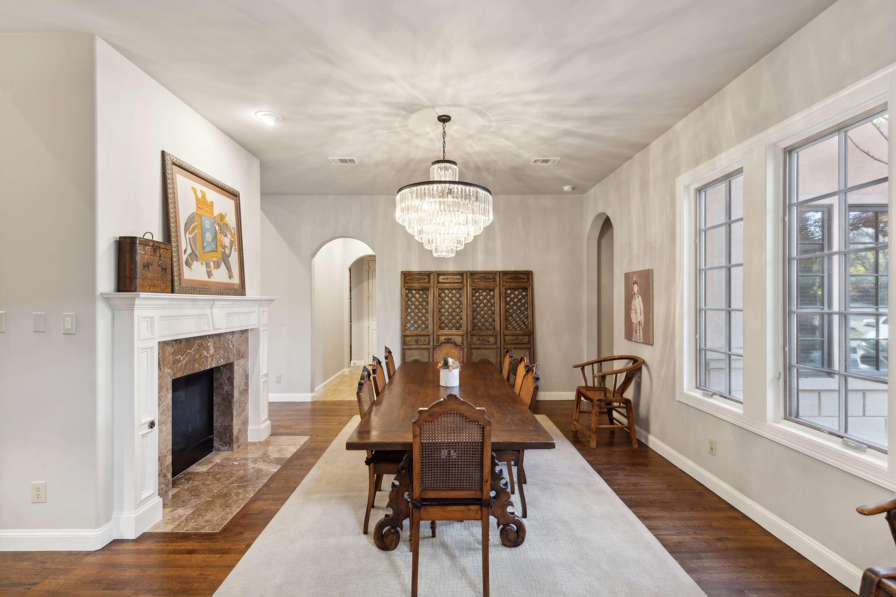 8411 Midway Road Dallas, TX 75209 - Photo 6 of 29 a living room with furniture windows and a fireplace
