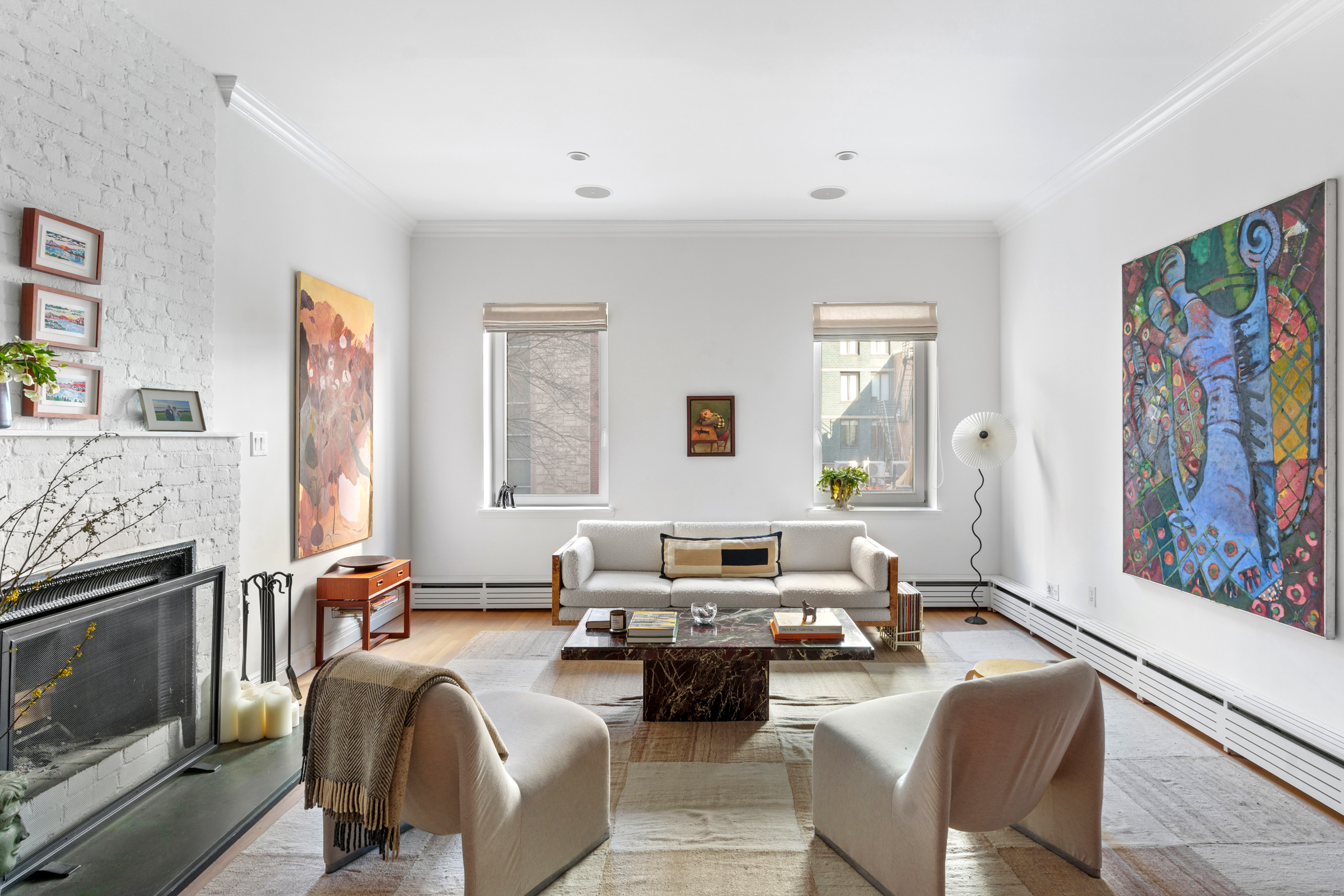 158 East 22nd Street, Unit 4 Manhattan, NY 10010 - Photo 4 of 15 a living room with furniture or couch and a fireplace