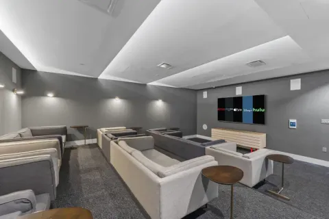 a bedroom with bed and flat screen tv