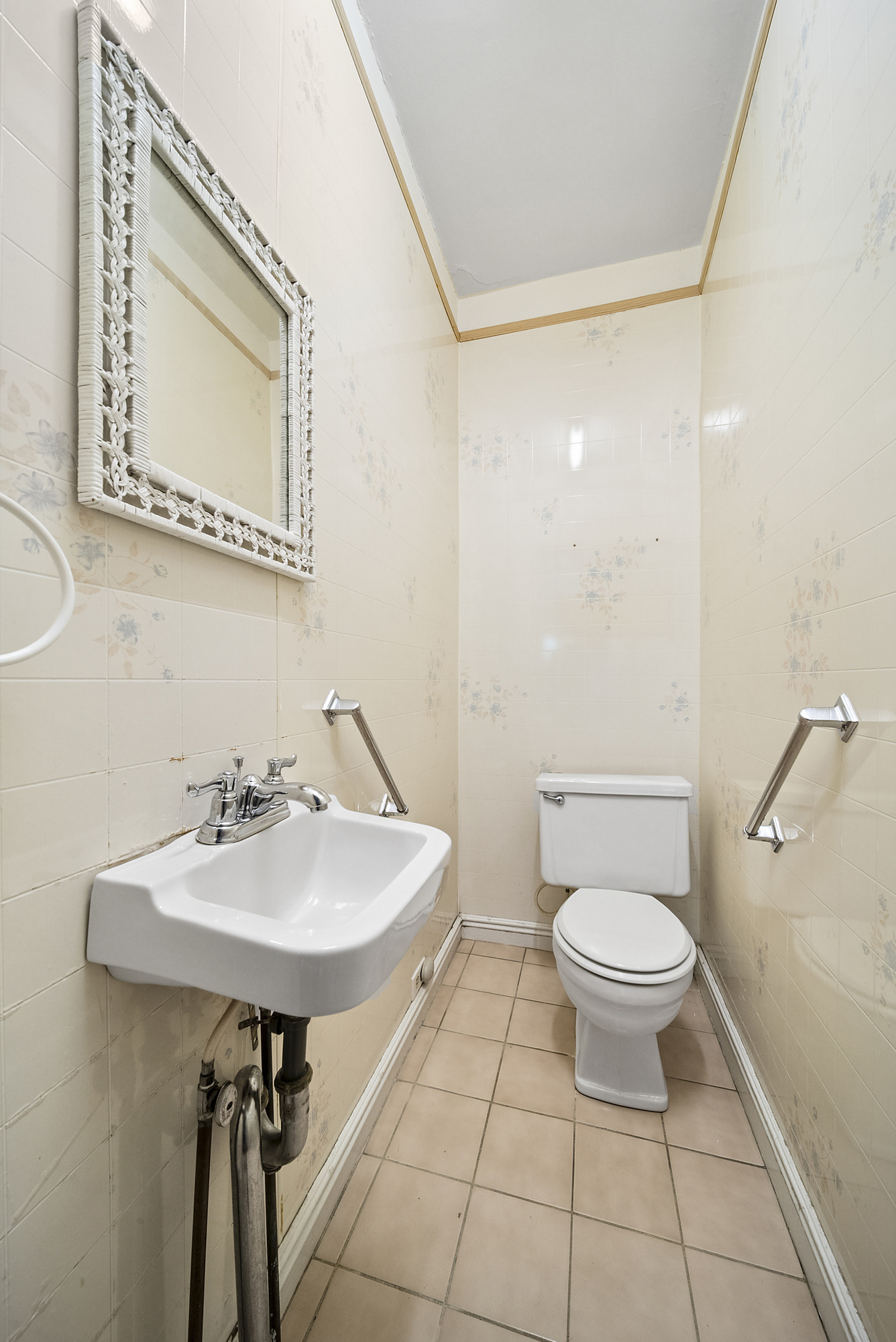34-15 88th Street Queens, NY 11372 - Photo 8 of 15 a bathroom with a sink a toilet and a mirror