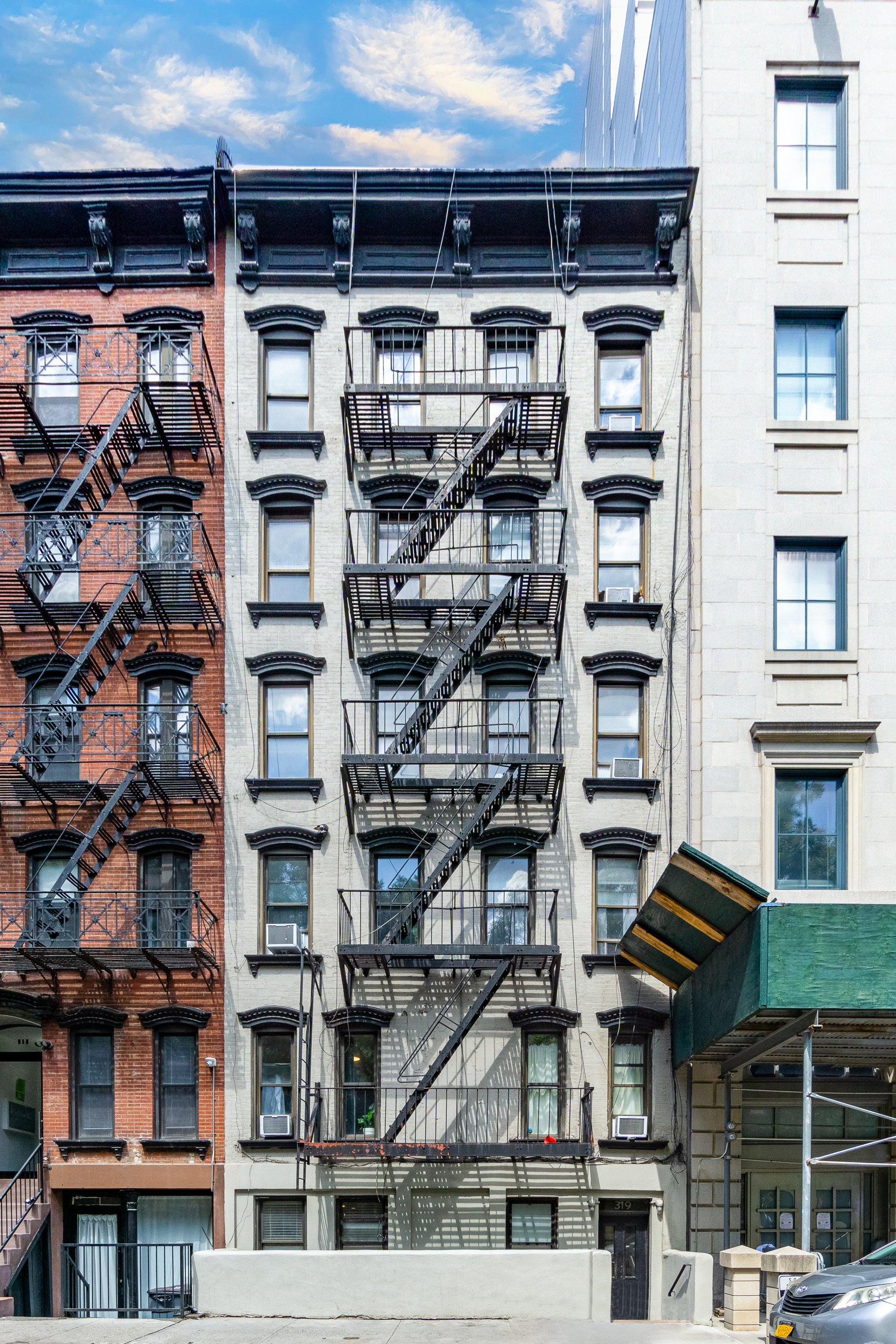 319 East 5th Street, Unit B Manhattan, NY 10003 - Photo 11 of 17 a front view of a building with glass windows