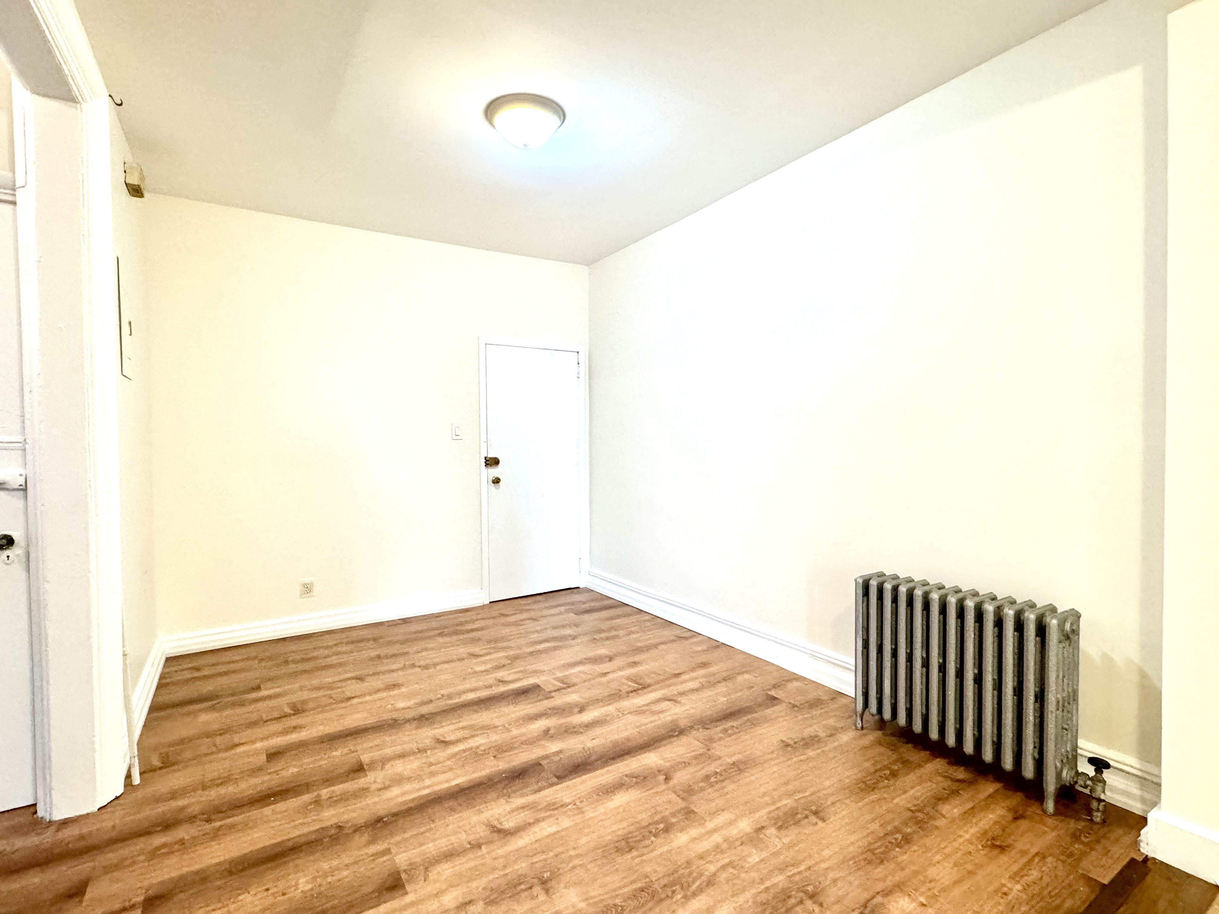 1688 Carroll Street, Unit 2 Brooklyn, NY 11213 - Photo 5 of 9 a view of a room with wooden floor