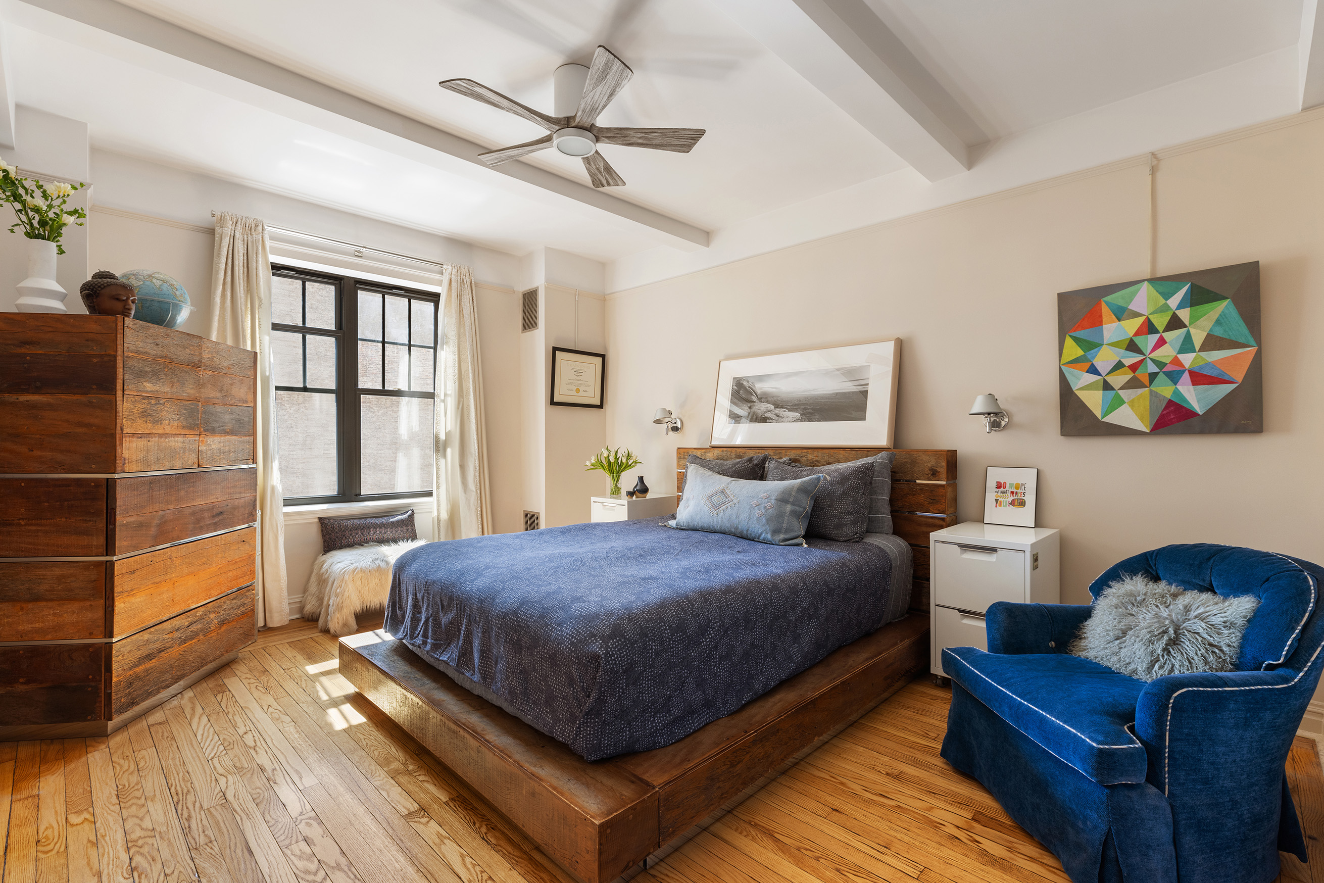 200 East 16th Street, Unit 5LM Manhattan, NY 10003 - Photo 6 of 16 a bedroom with a bed and wooden floor