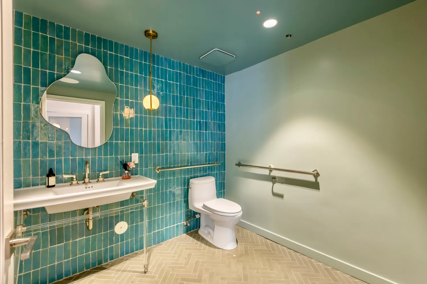 a view of a bedroom with wooden floor and a bed