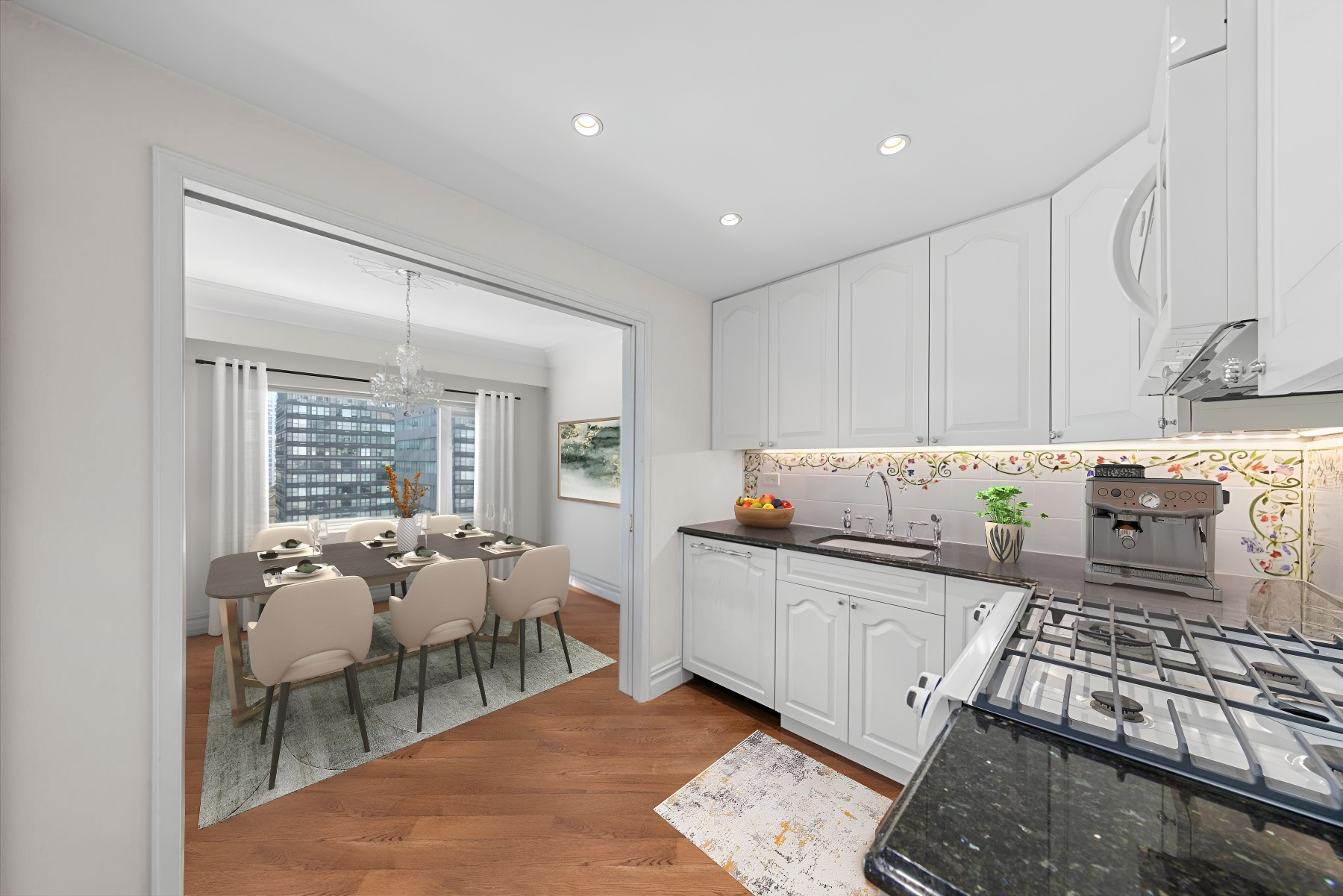 118 East 60th Street, Unit 33G Manhattan, NY 10022 - Photo 2 of 8 a kitchen with stainless steel appliances granite countertop a stove a sink and a refrigerator