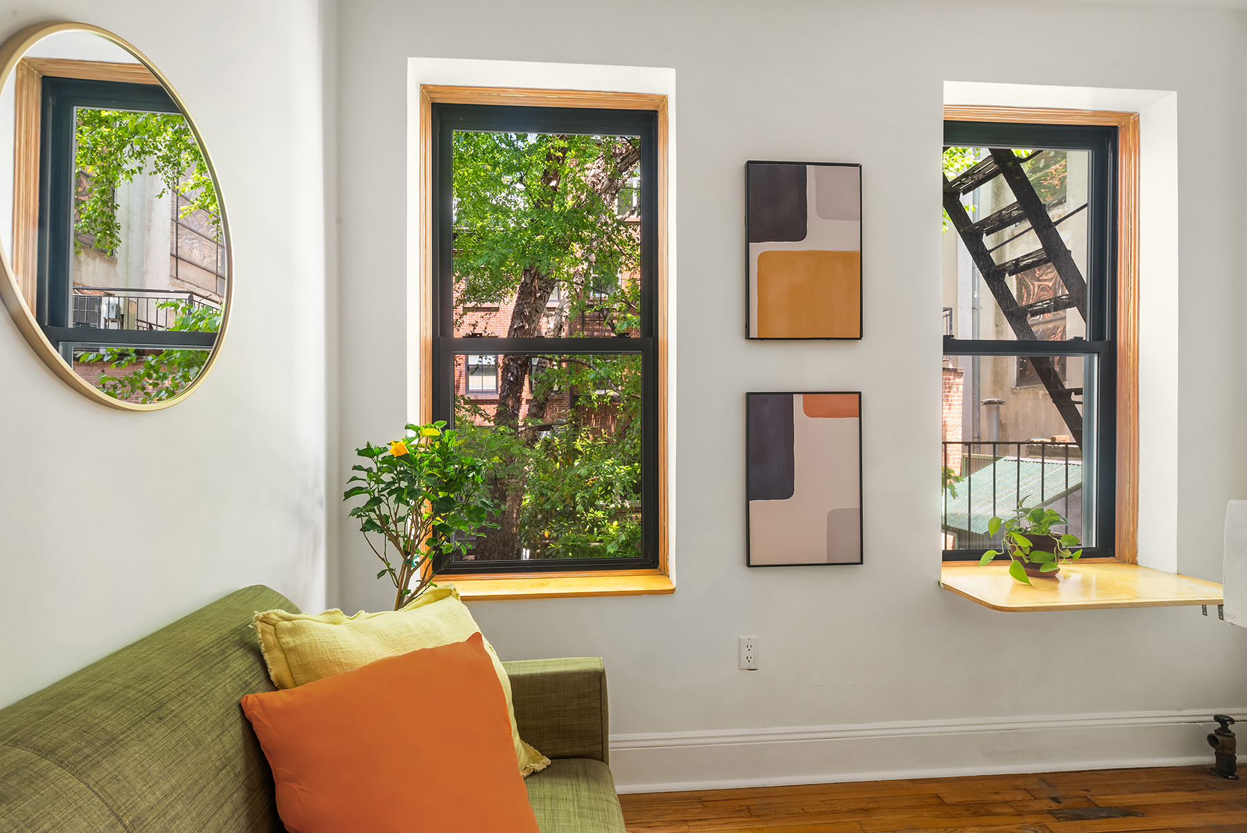 41 Perry Street, Unit 2A Manhattan, NY 10014 - Photo 4 of 12 a living room with furniture and a window
