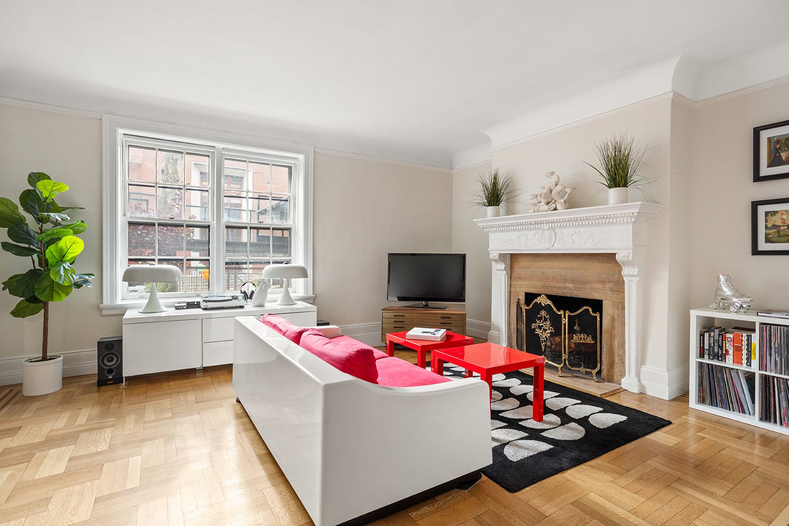 33-39 80th Street, Unit 2 Queens, NY 11372 - Photo 2 of 19 a living room with furniture and a fireplace