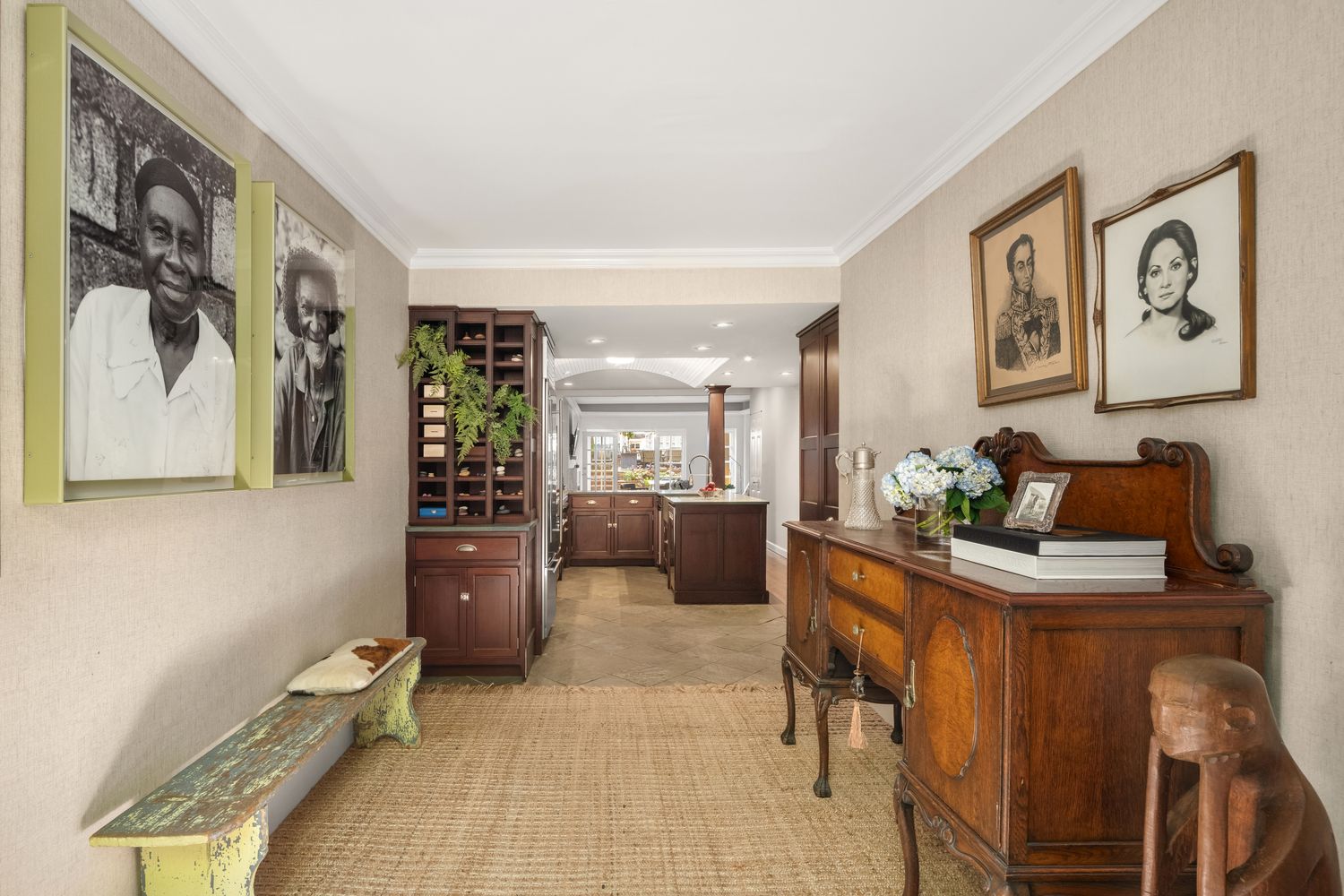 a living room with furniture and wall painting