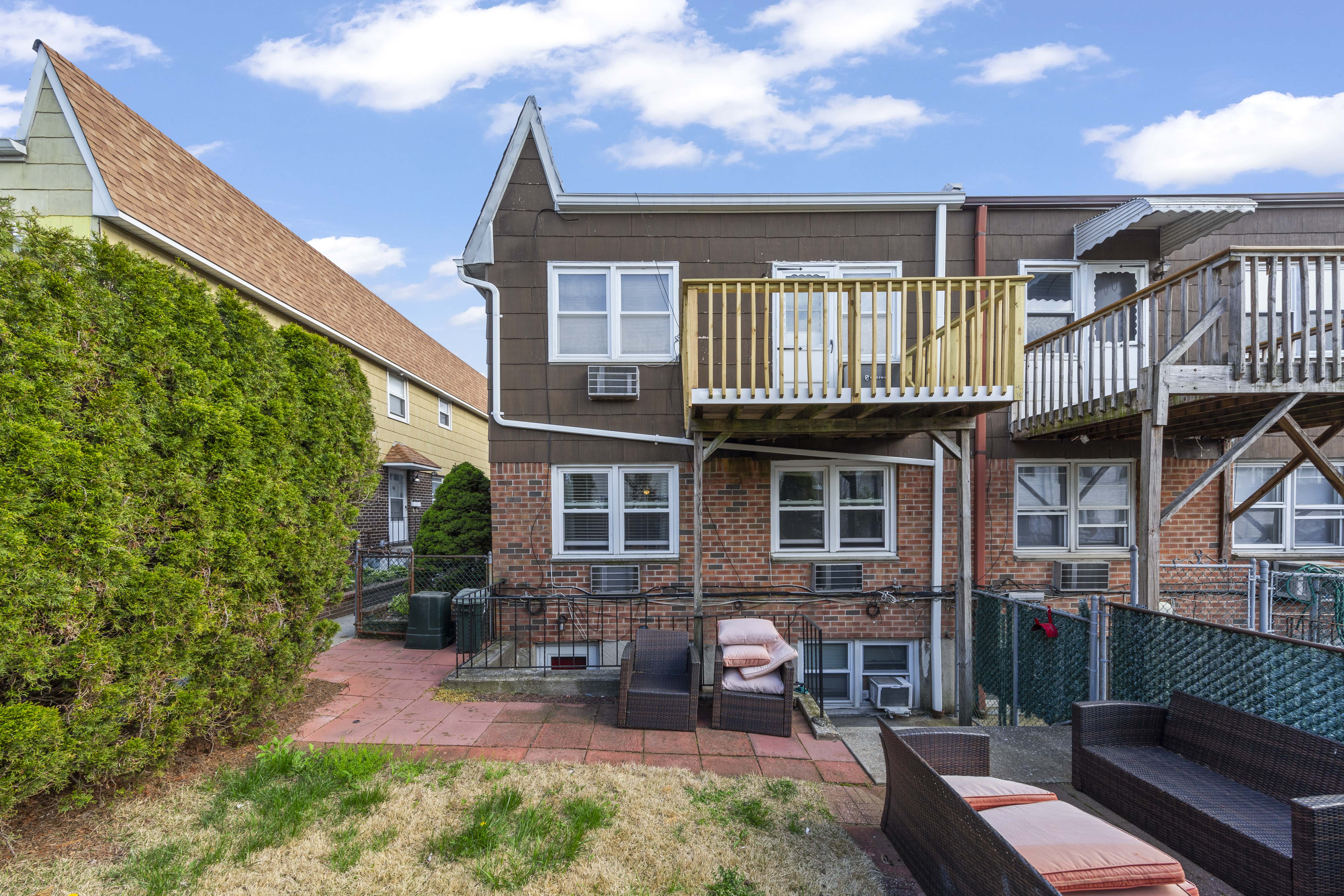 240-47 68th Avenue Queens, NY 11362 - Photo 36 of 39 a front view of a house with garden