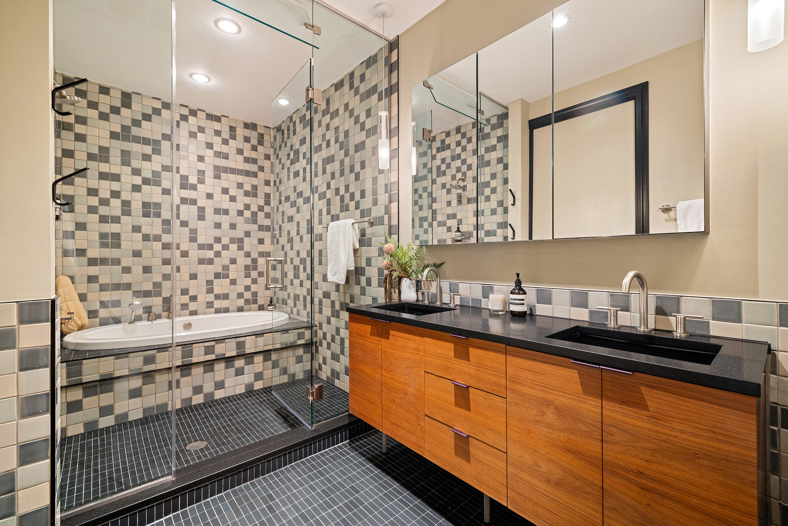 144 North 8th Street, Unit 12A Brooklyn, NY 11249 - Photo 13 of 21 a bathroom with a double vanity sink a mirror and a shower