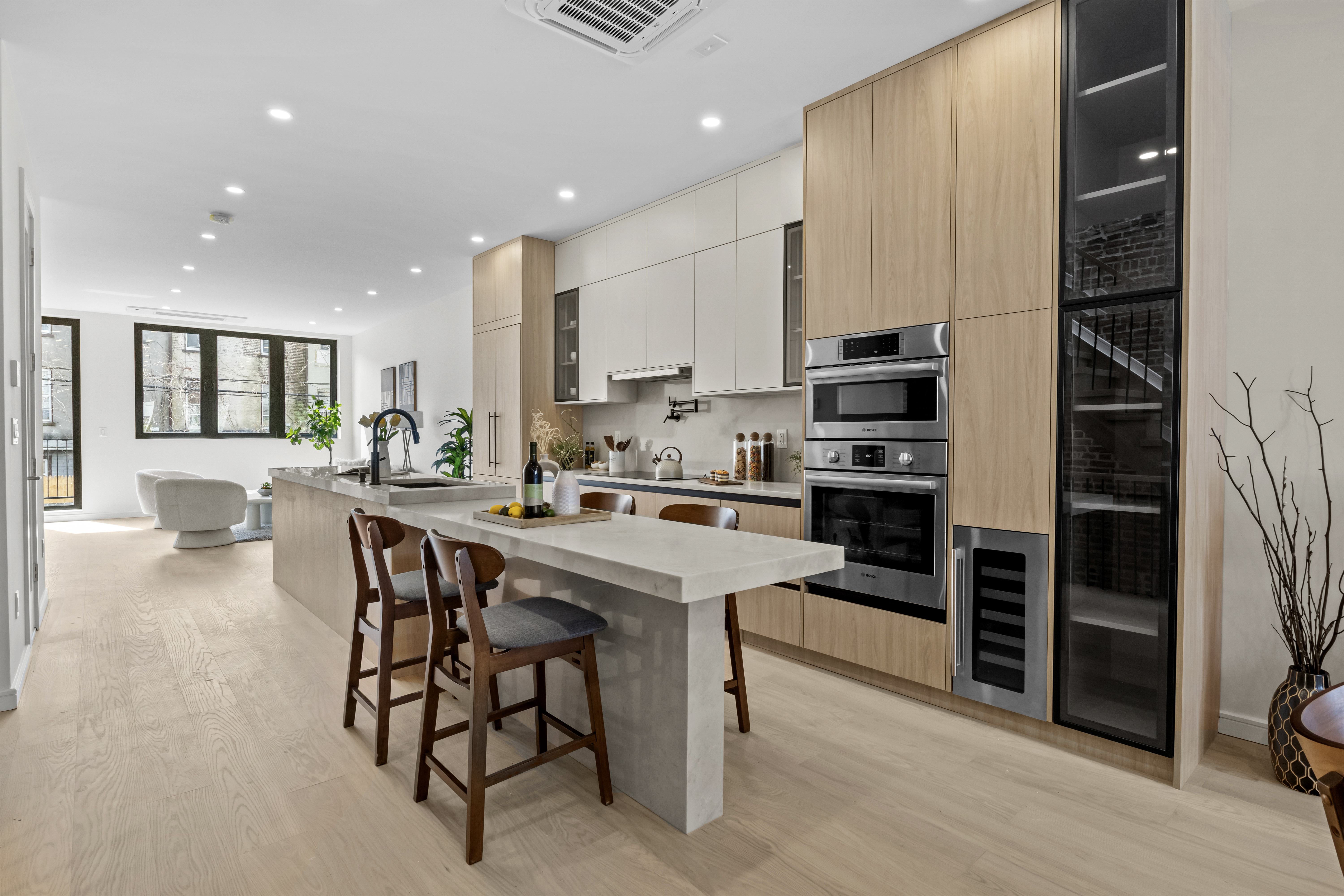 320 10th Street Brooklyn, NY 11215 - Photo 3 of 27 a kitchen with stainless steel appliances kitchen island granite countertop a stove a sink a refrigerator and a dining table with wooden floor