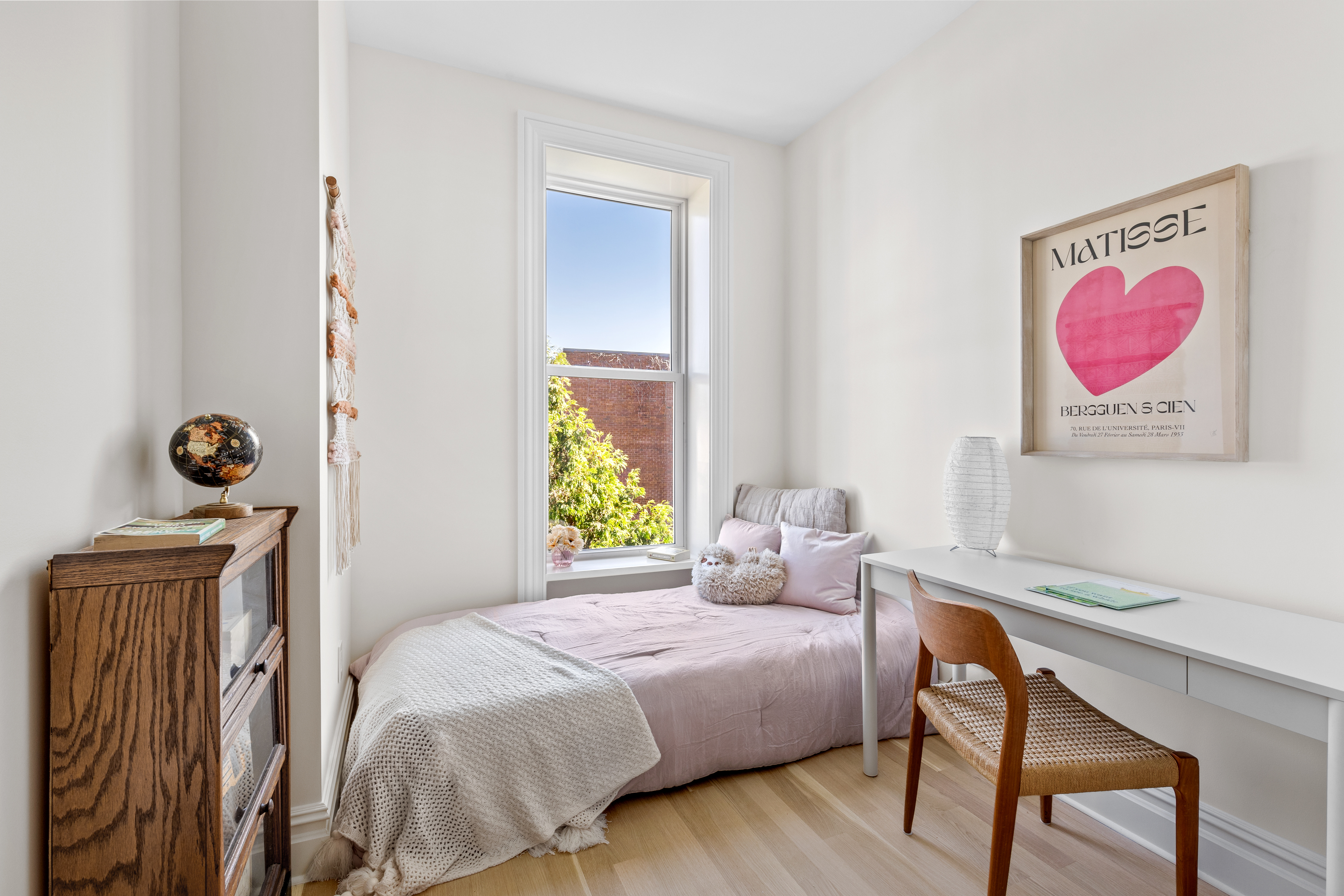 489 7th Avenue, Unit 3 Brooklyn, NY 11215 - Photo 6 of 11 a bedroom with a bed and a table in it