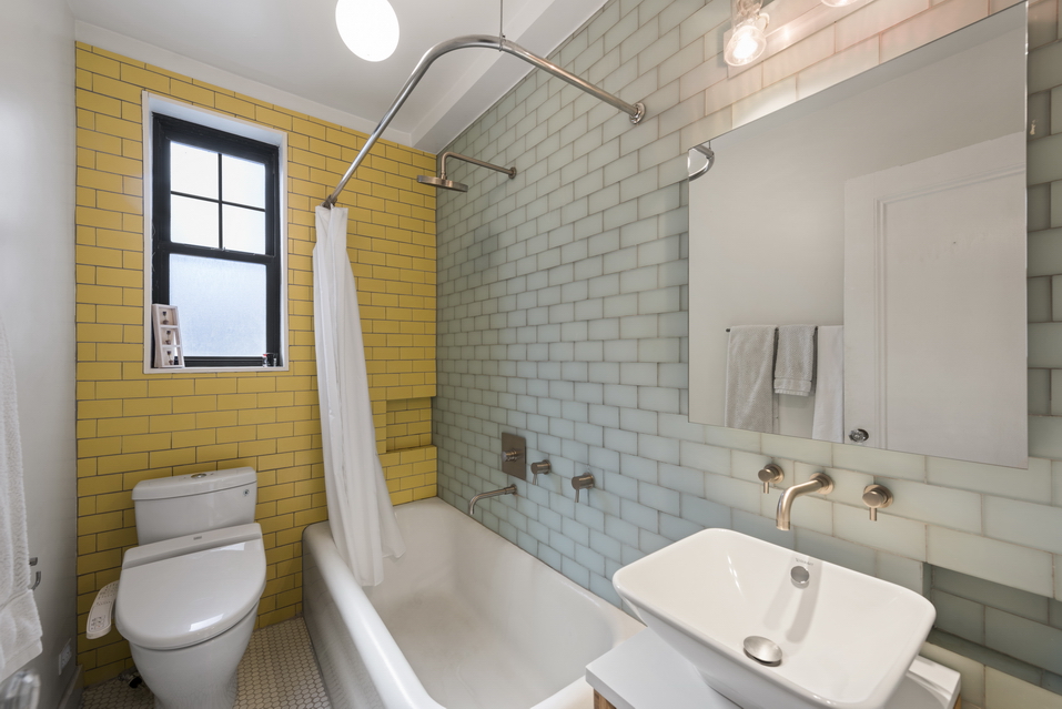 170 2nd Avenue, Unit 5E Manhattan, NY 10003 - Photo 6 of 10 a bathroom with a sink toilet and shower