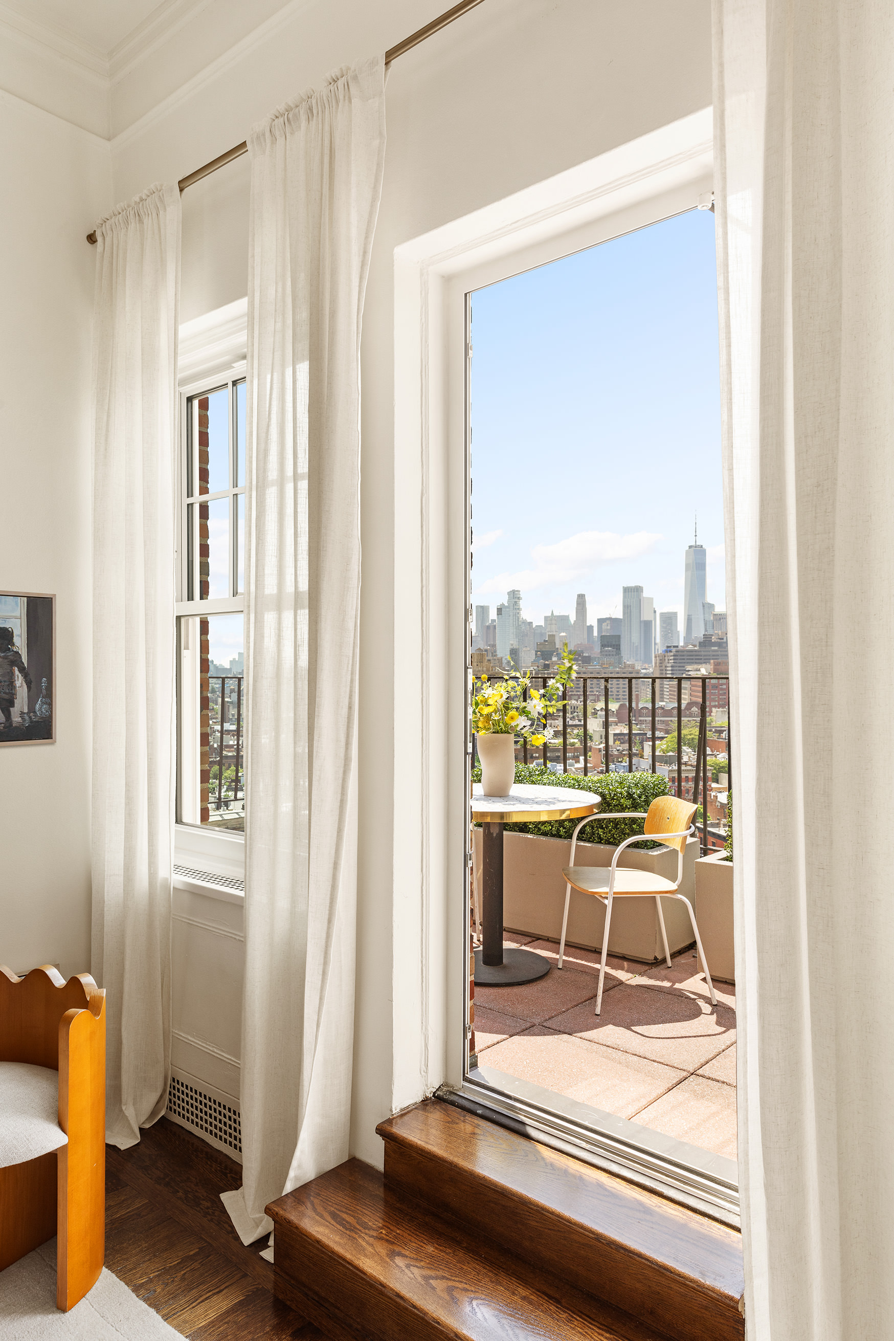 302 West 12th Street, Unit PHE Manhattan, NY 10014 - Photo 3 of 16 a room with gym equipment and a large window