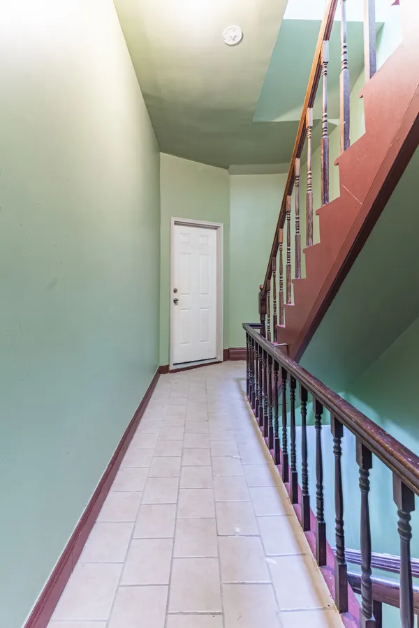 a view of a hallway with stairs