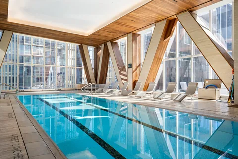 a view of a kitchen with a large window and furniture