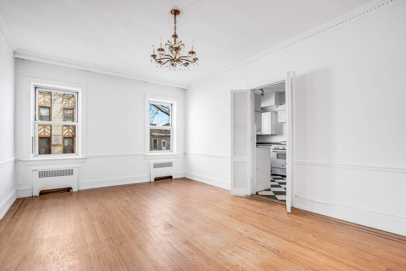 8301 4th Avenue Brooklyn, NY 11209 - Photo 4 of 20 wooden floor in an empty room with a window