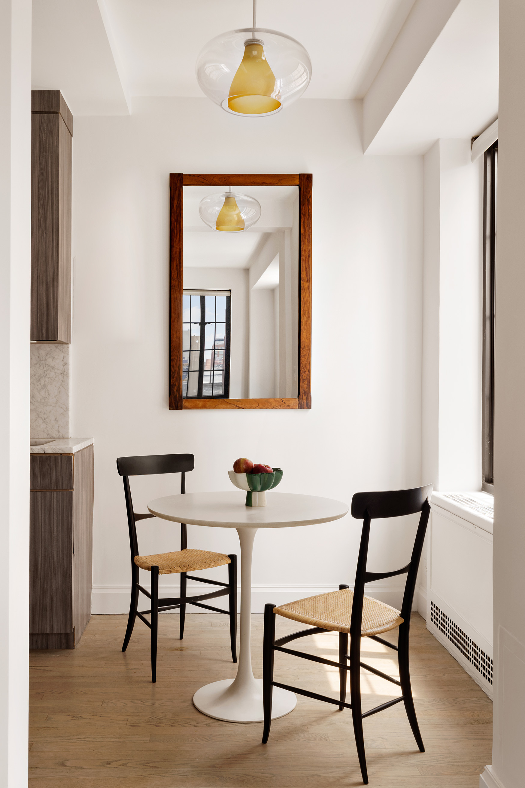 201 West 16th Street, Unit 9A Manhattan, NY 10011 - Photo 6 of 14 a view of a room that has a table and a chair