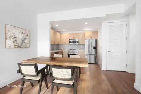 a kitchen with a table and chairs in it