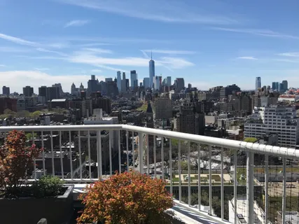 a view of a balcony with city