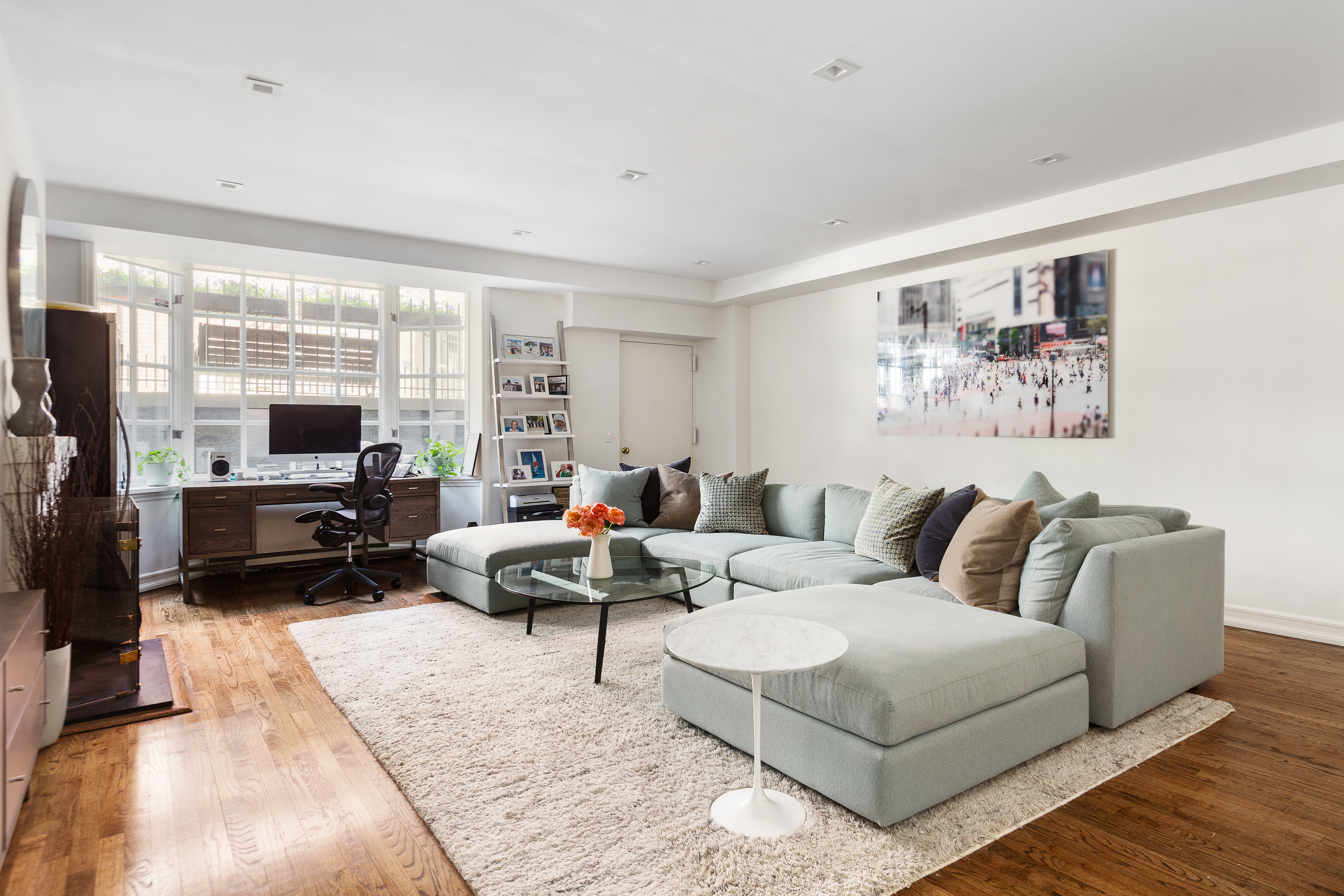 687 Greenwich Street, Unit TH7 Manhattan, NY 10014 - Photo 8 of 23 a living room with furniture large window and a flat screen tv