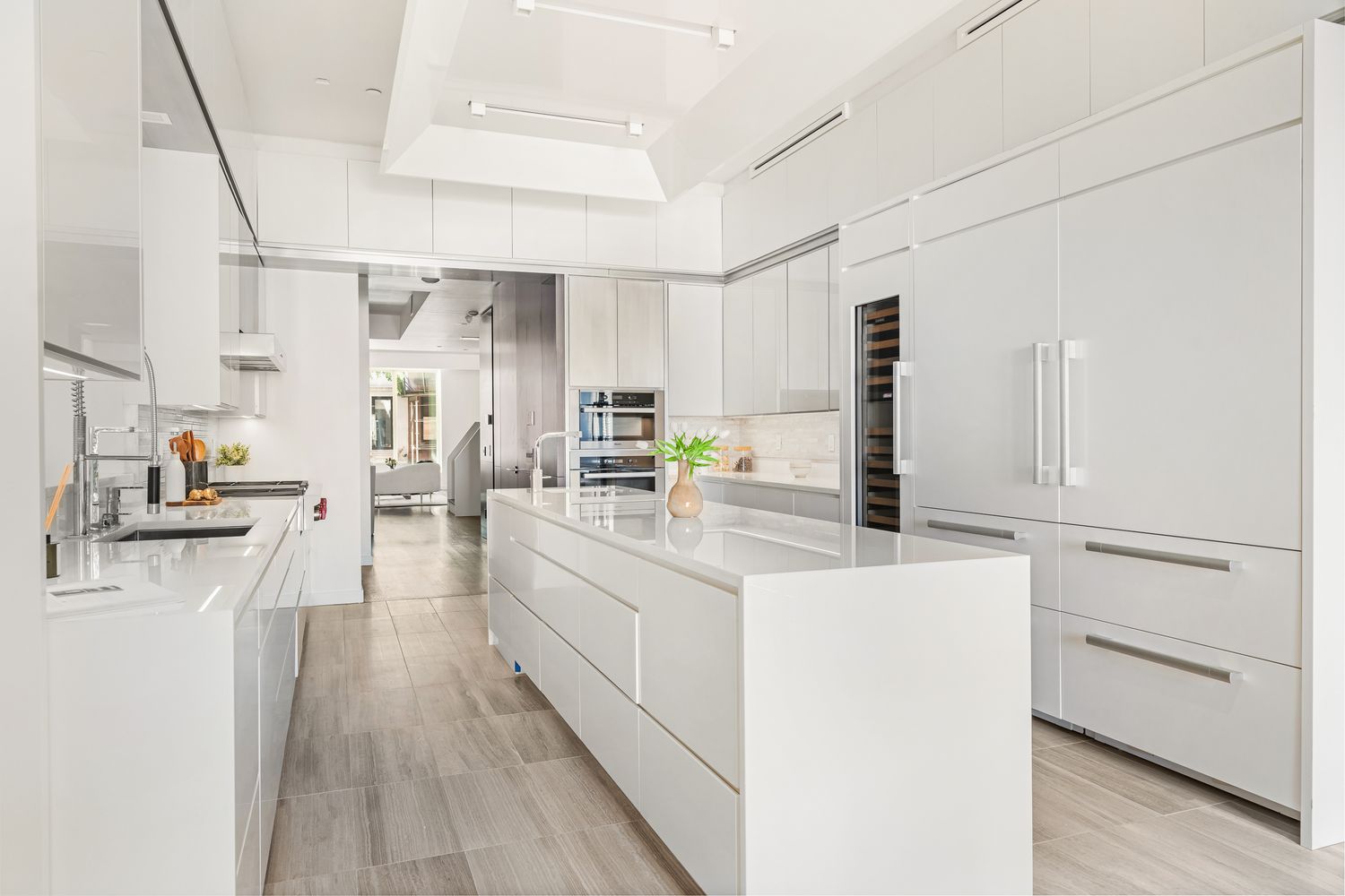 a kitchen with cabinets a sink and appliances