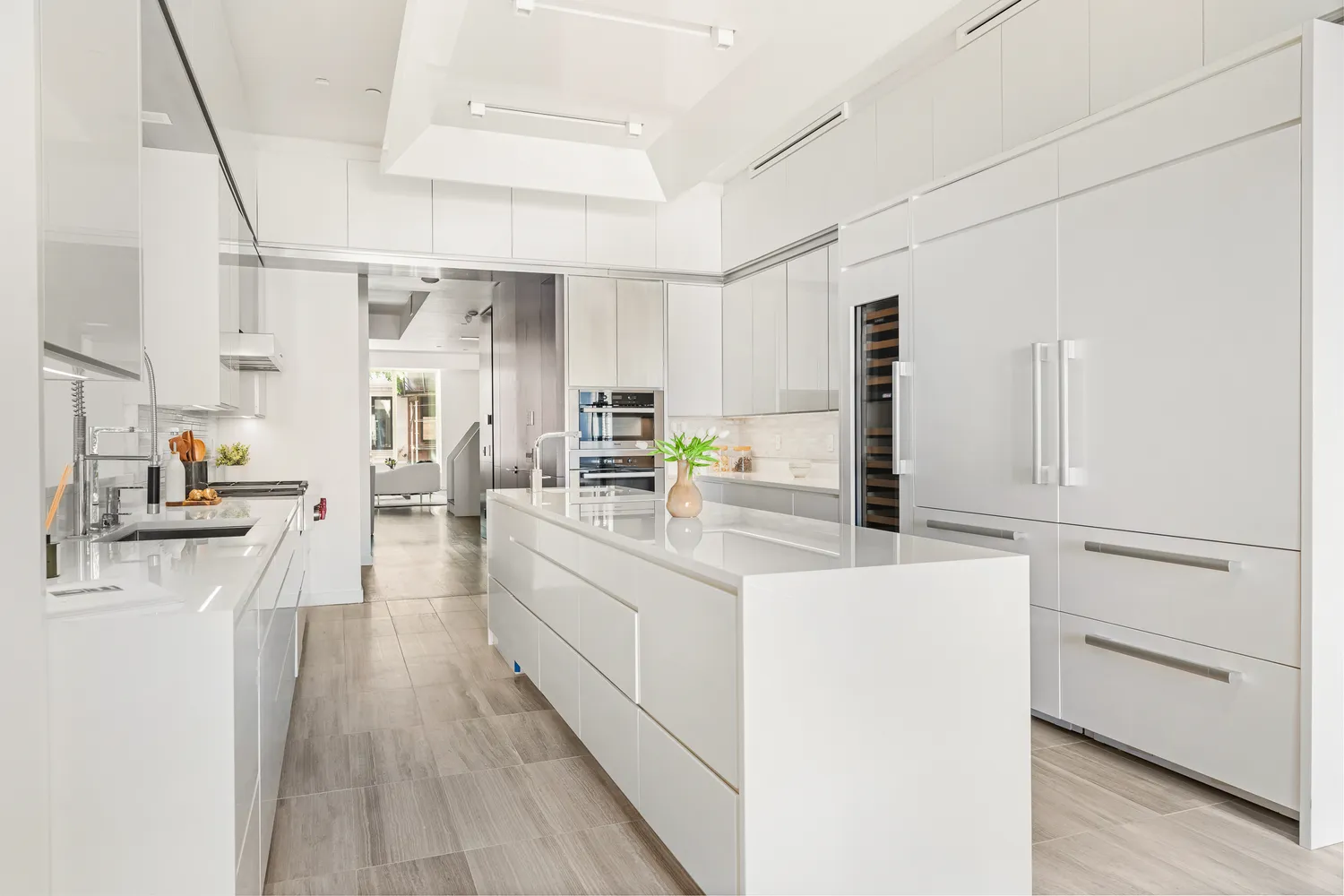 a kitchen with cabinets a sink and appliances