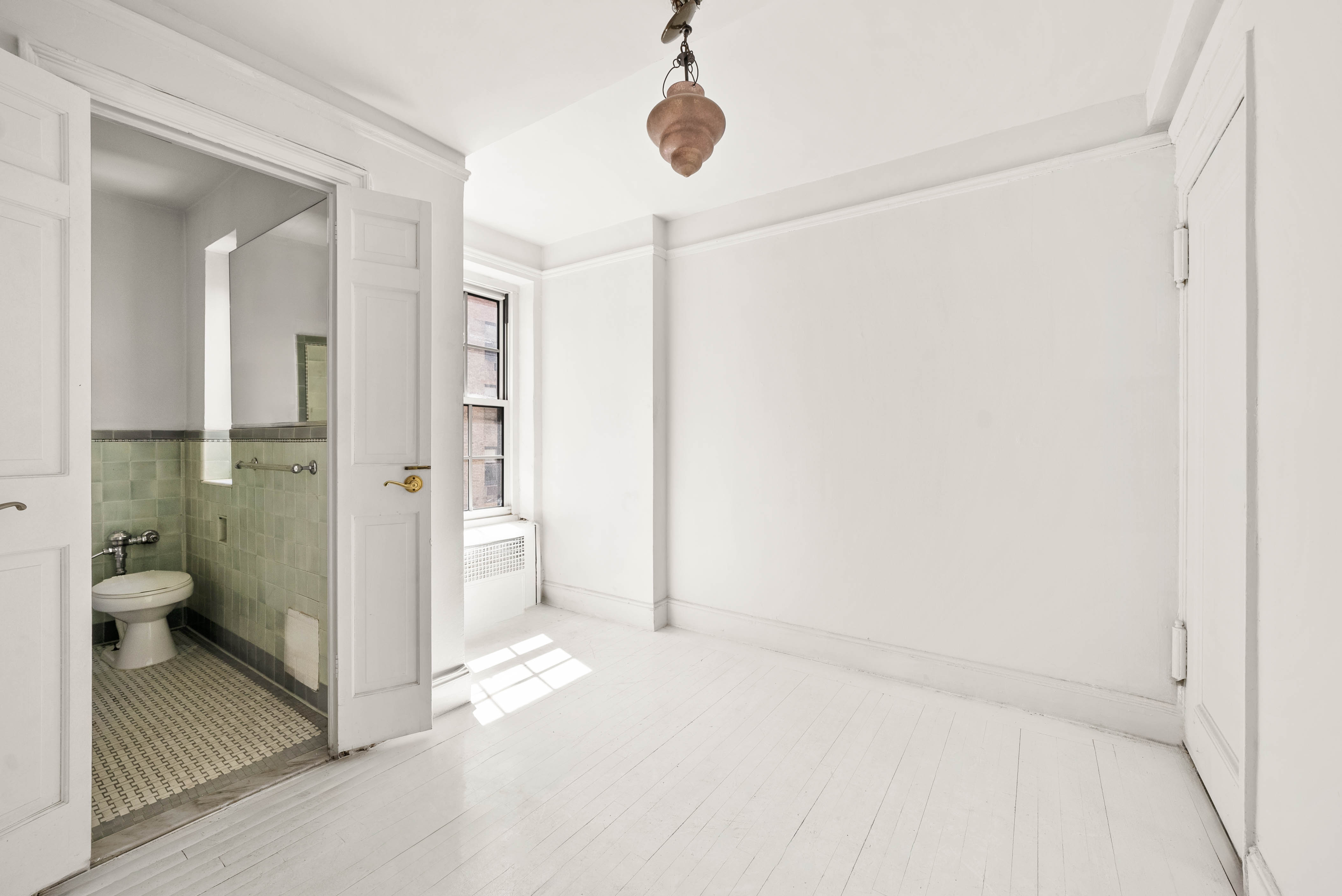 12 East 88th Street, Unit PH11/12B Manhattan, NY 10128 - Photo 6 of 22 a bathroom with a shower and a toilet