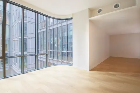 a view of empty room with floor to ceiling window