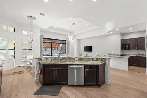 a kitchen with lots of counter top space and dining table