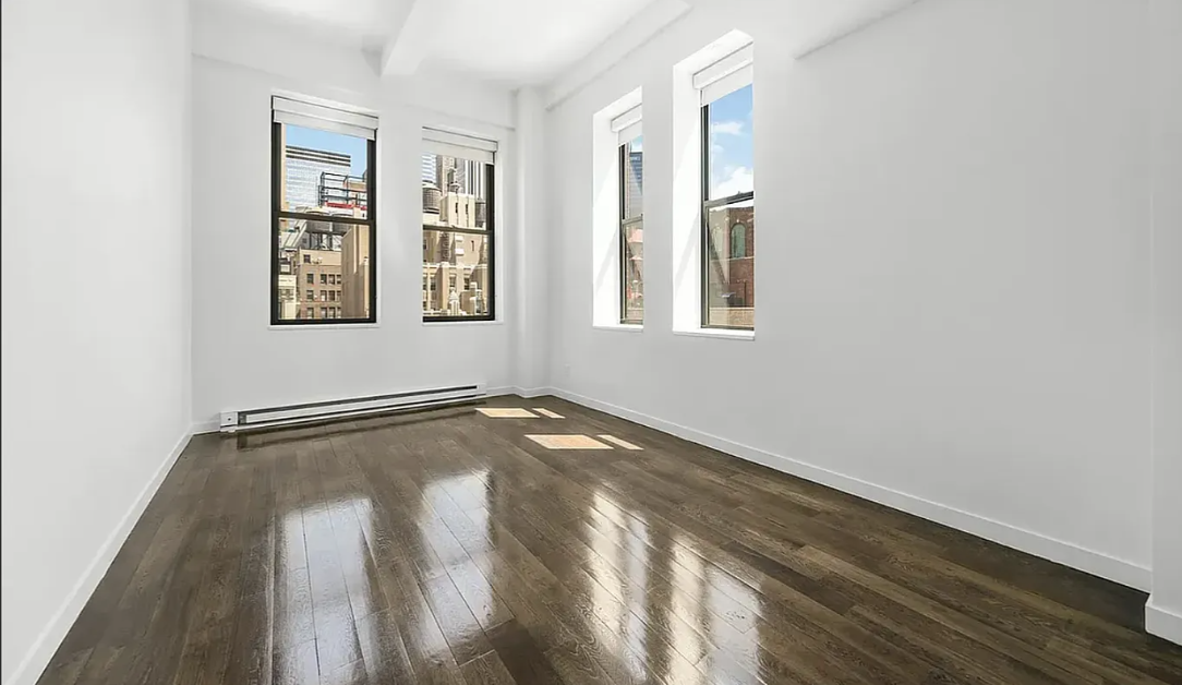 11 East 36th Street, Unit 1203 Manhattan, NY 10016 - Photo 1 of 8 a view of an empty room with a window