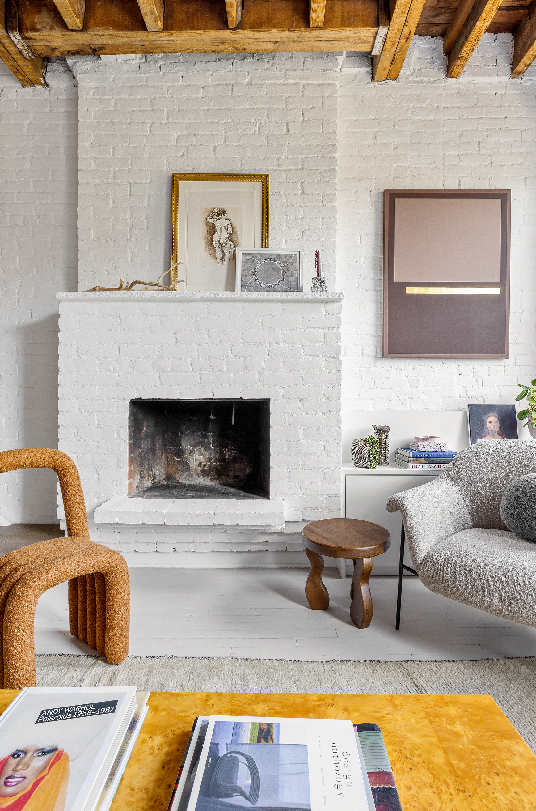 281 West 11th Street, Unit 4/5C Manhattan, NY 10014 - Photo 5 of 18 a living room with furniture and a fireplace