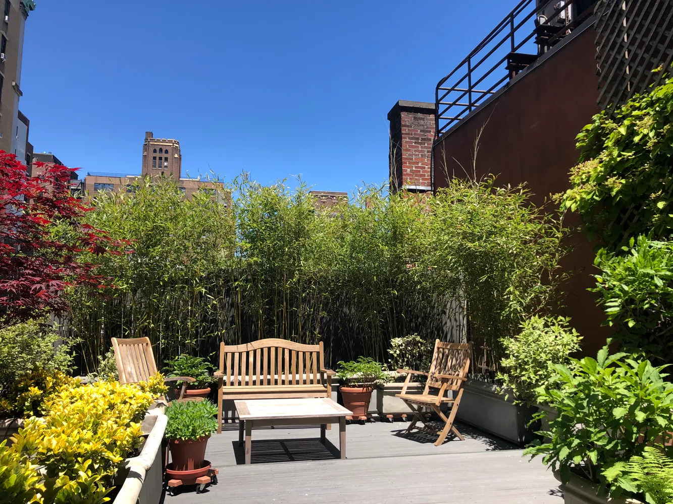a view of a chair and tables front of the house