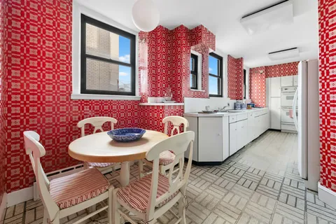 a dinning room with furniture and window