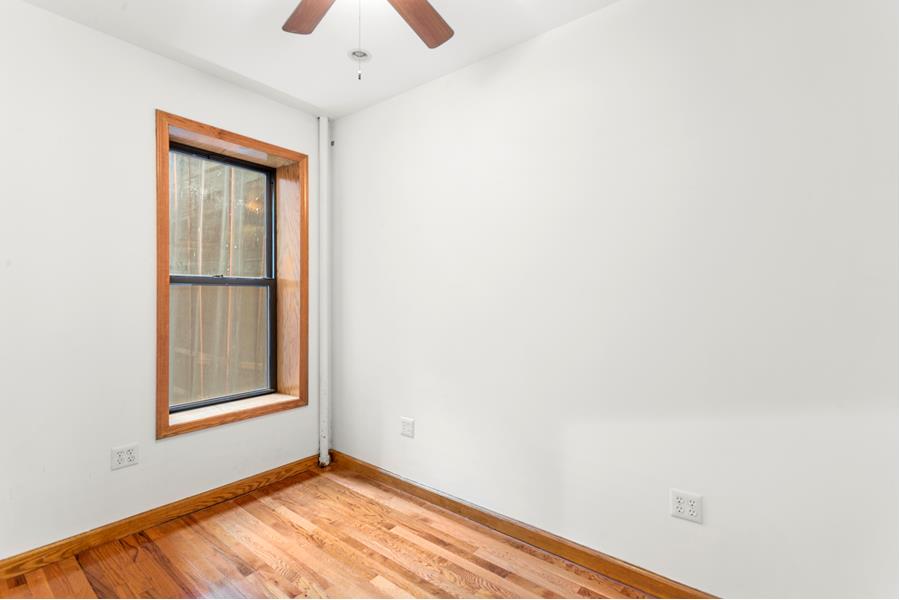56 MacDougal Street, Unit 16 Manhattan, NY 10012 - Photo 5 of 6 a view of an empty room with window and closet