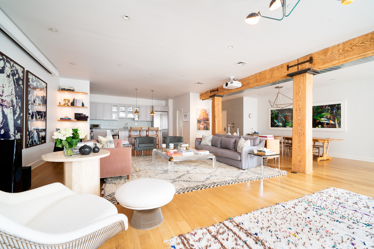 481 Washington Street, Unit 6N Manhattan, NY 10013 - Photo 1 of 10 a living room with dining table and wooden floor