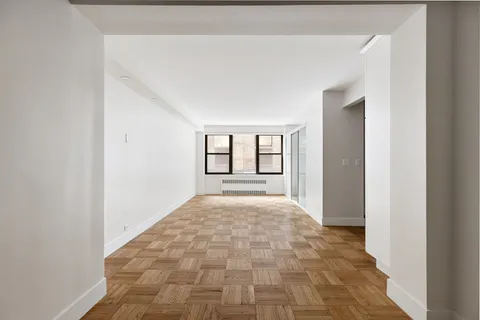a view of an empty room with windows