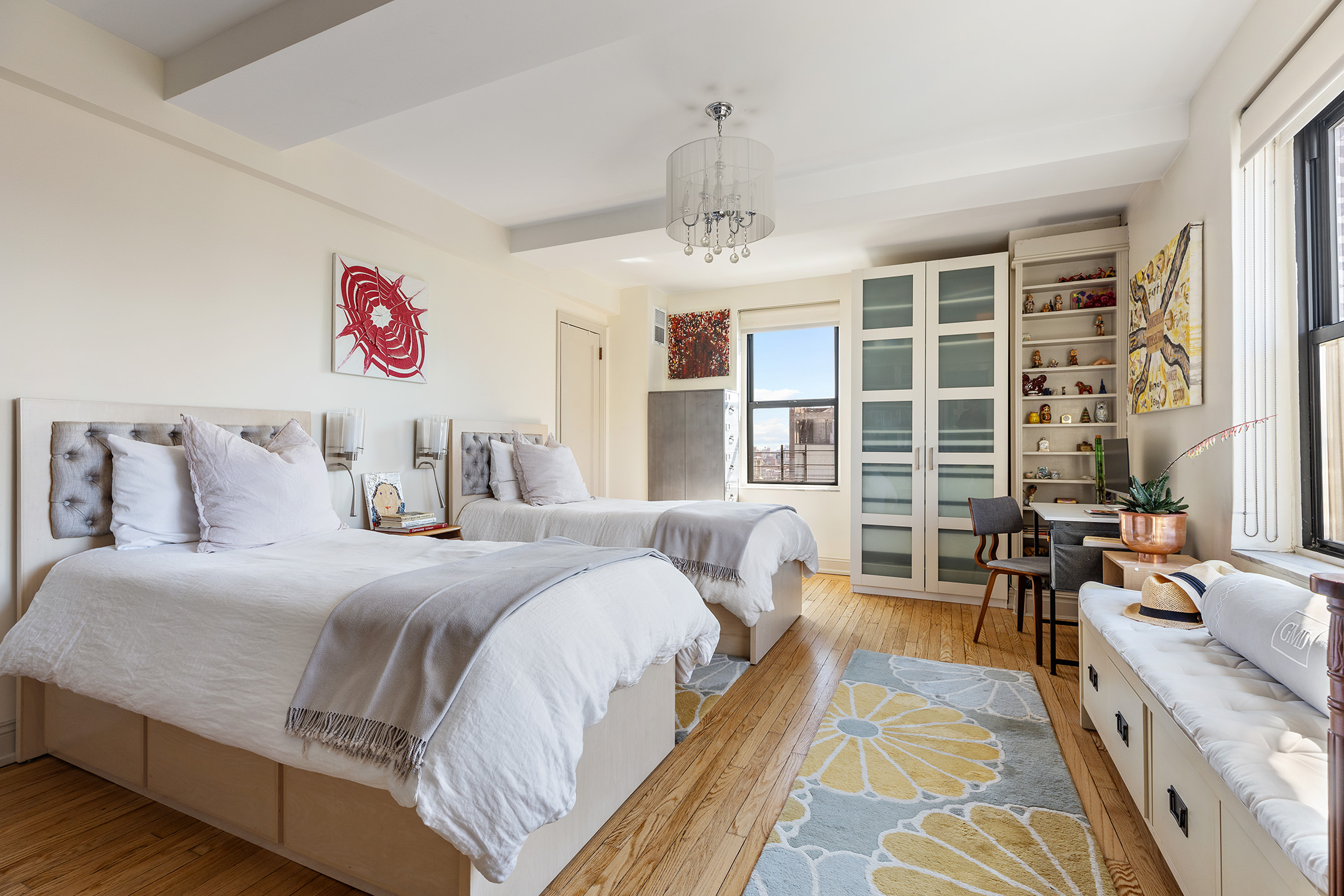 200 East 16th Street, Unit 19D Manhattan, NY 10003 - Photo 12 of 14 a spacious bedroom with a bed a couch and a large window