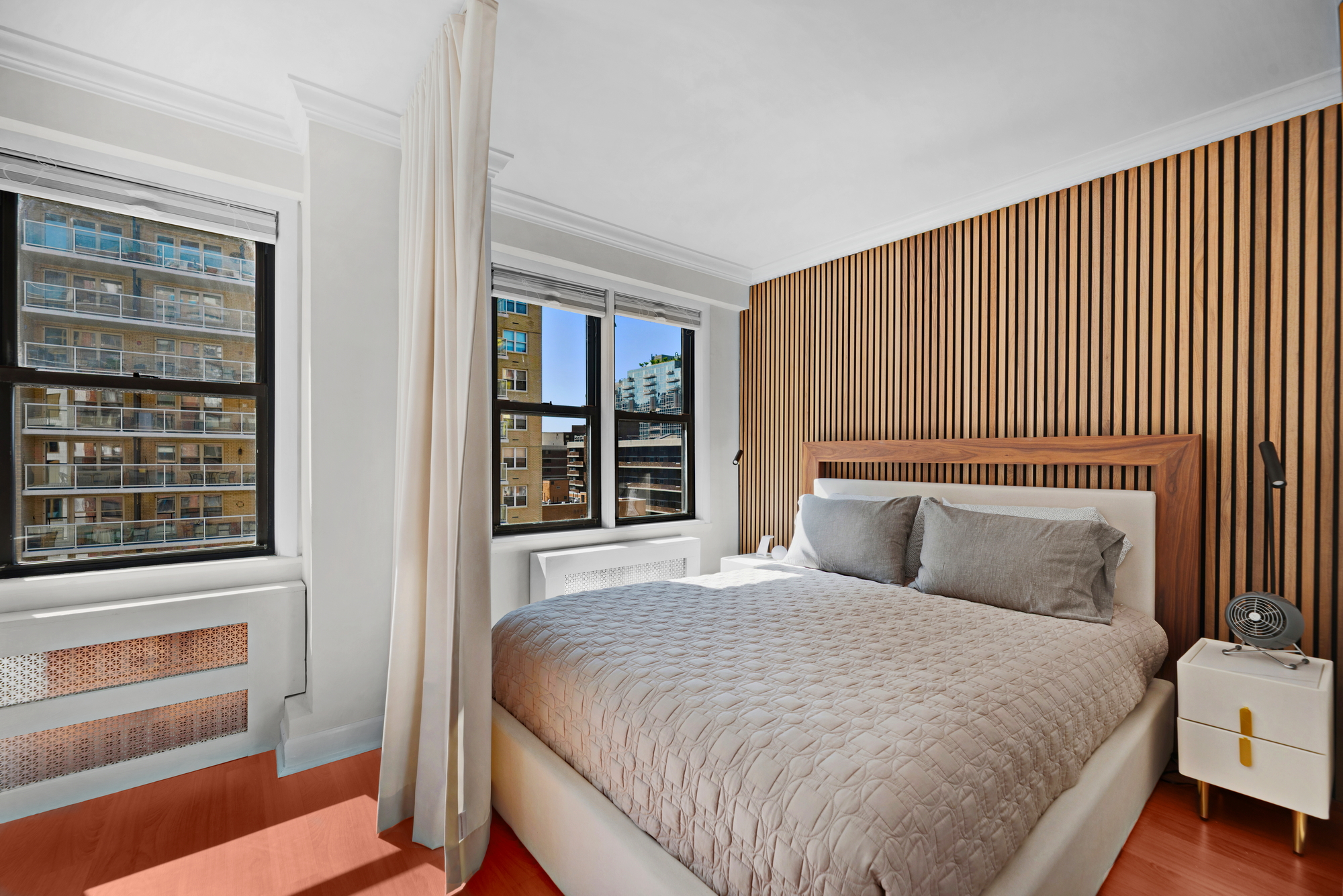 245 East 24th Street, Unit 10E Manhattan, NY 10010 - Photo 2 of 12 a bedroom with a bed and a window