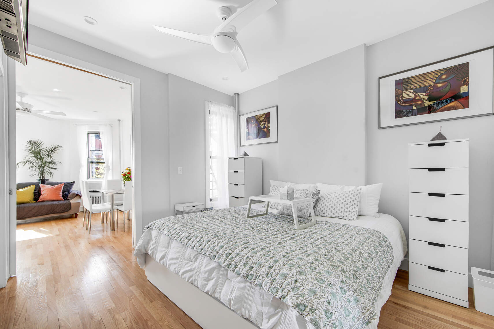 1878 Adam Clayton Powell Jr Boulevard, Unit 52 Manhattan, NY 10026 - Photo 4 of 13 a bedroom with a large bed and a couch