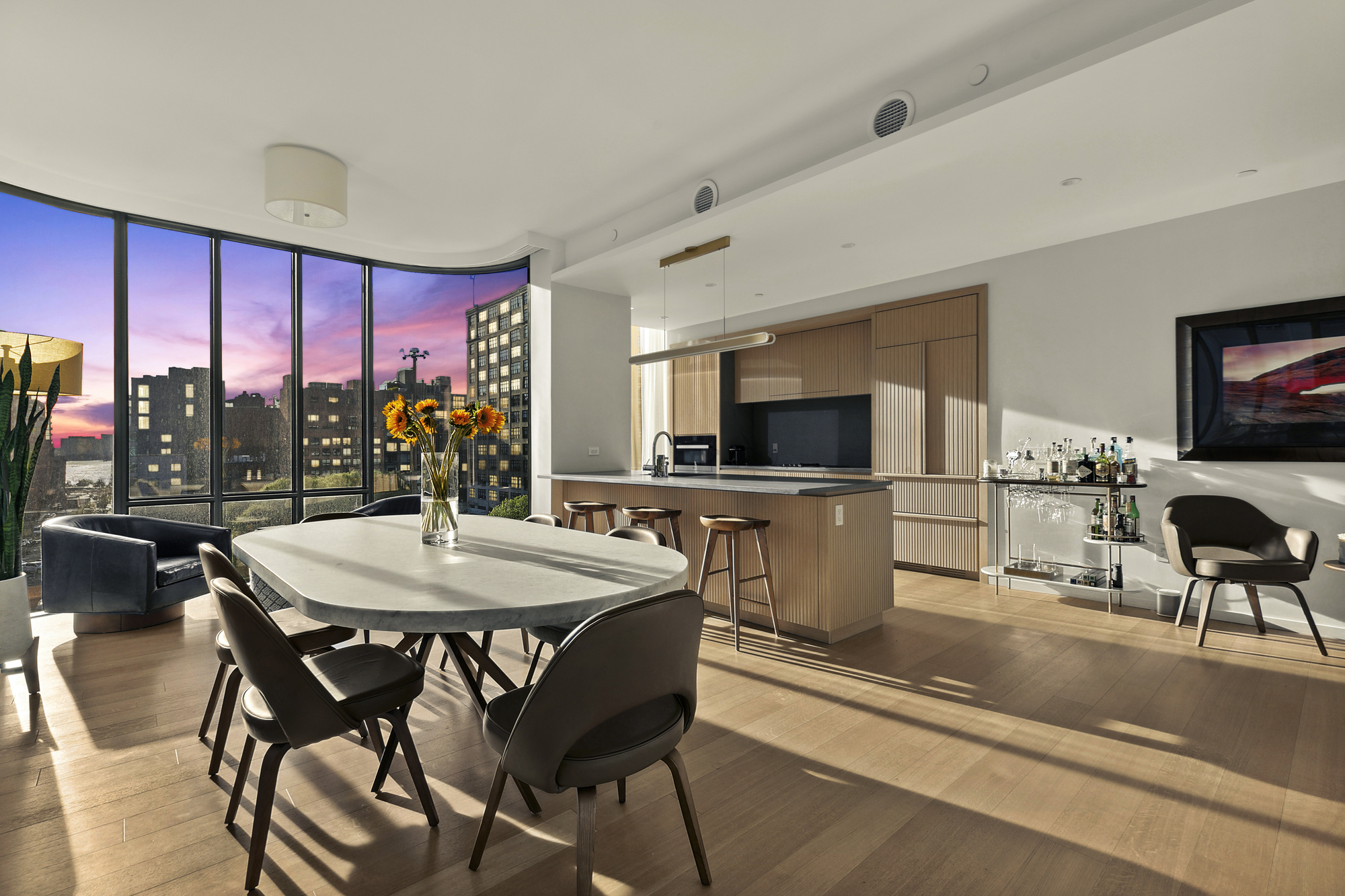 565 Broome Street, Unit S8C Manhattan, NY 10013 - Photo 2 of 24 a view of a dining room with furniture window and wooden floor