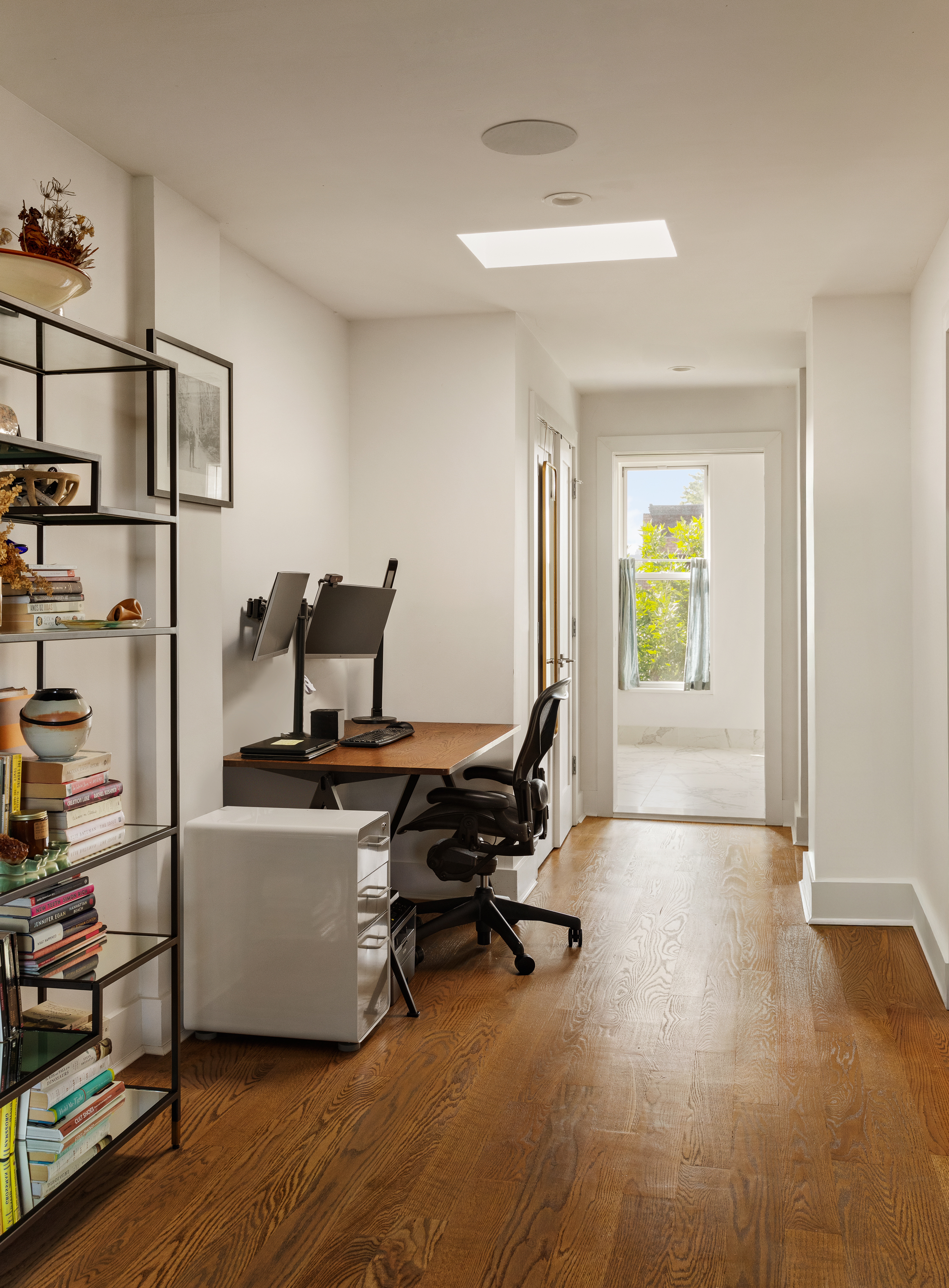 197 Madison Street Brooklyn, NY 11216 - Photo 8 of 19 a view of a workspace with furniture and a window