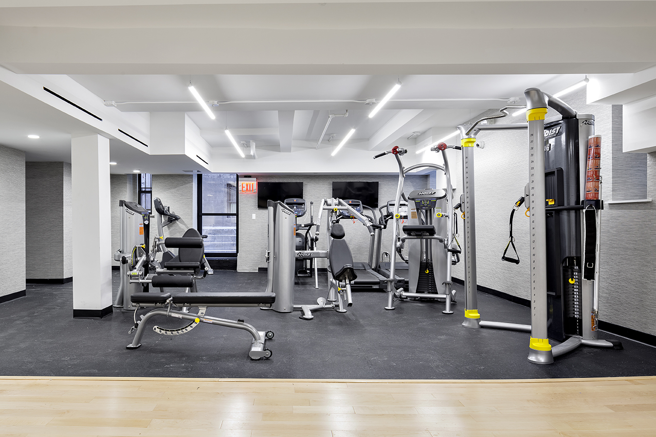 245 West 25th Street, Unit 2C Manhattan, NY 10001 - Photo 7 of 13 a room with gym equipment and gym equipment
