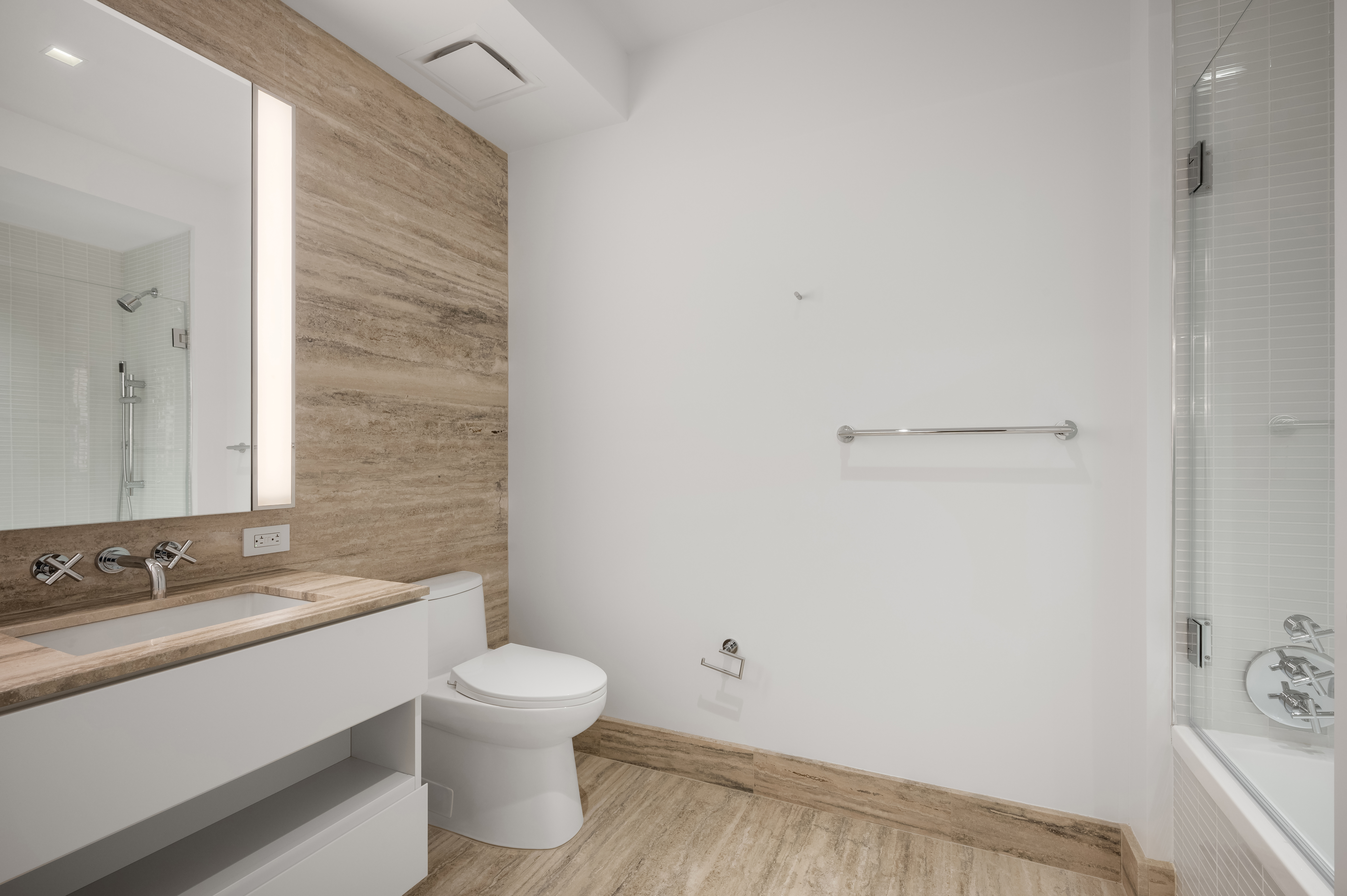 1 Wall Street, Unit 915 Manhattan, NY 10005 - Photo 5 of 18 a bathroom with a sink toilet and shower