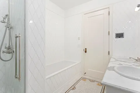 a bathroom with a sink and a shower