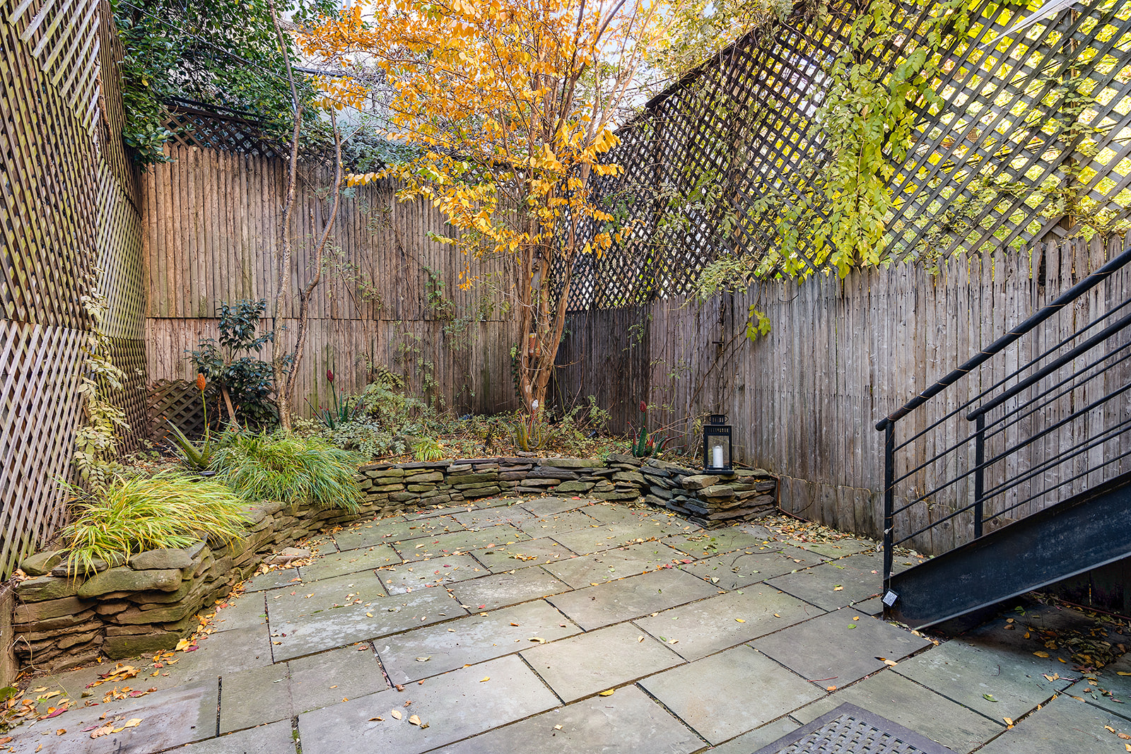 146 Berkeley Place Brooklyn, NY 11217 - Photo 12 of 21 a view of a backyard with wooden fence
