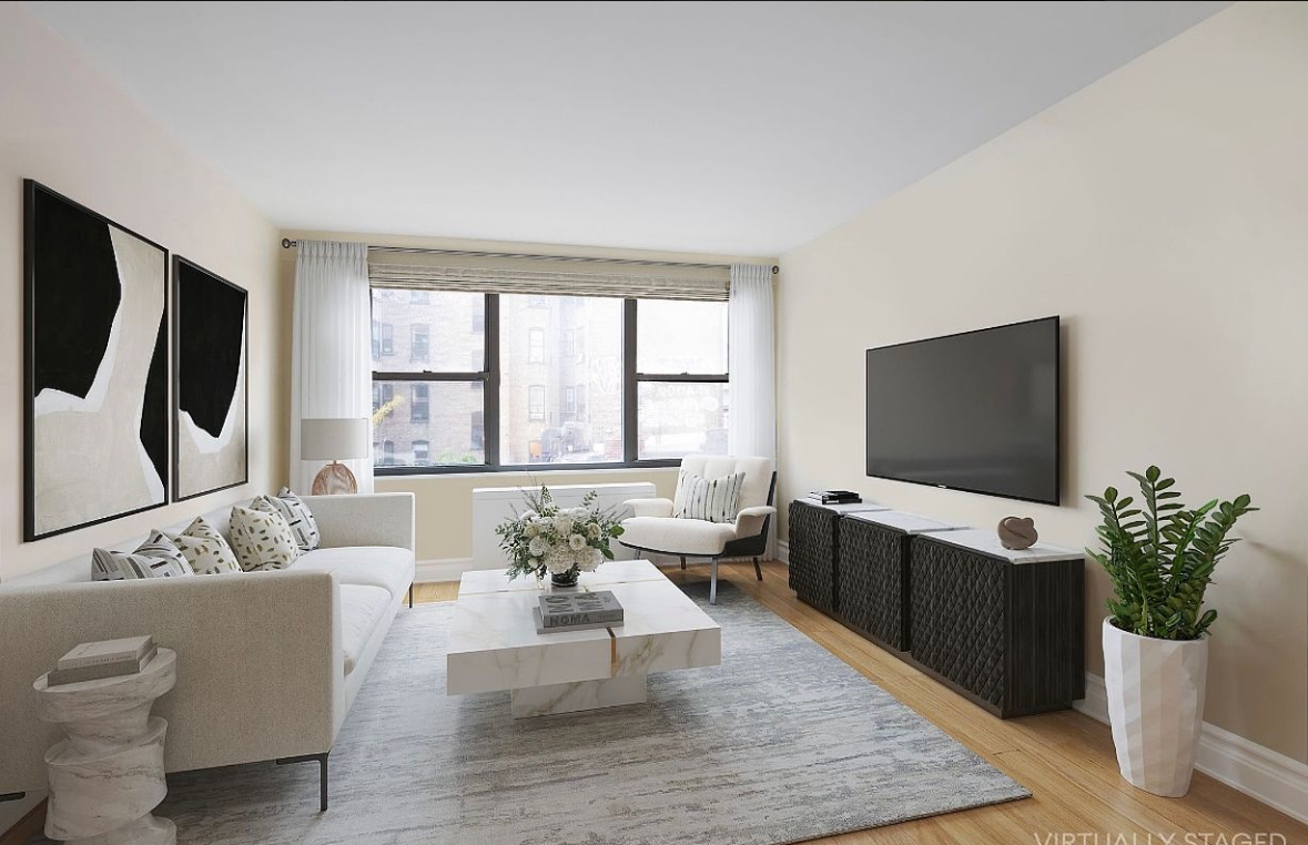 a living room with furniture a flat screen tv and a floor to ceiling window