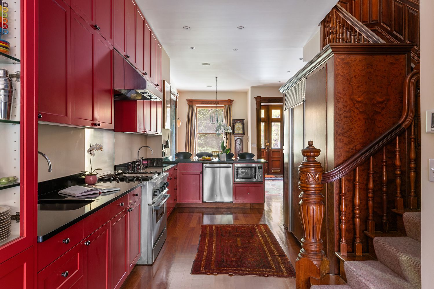 a kitchen with wooden cabinets and a stove top oven