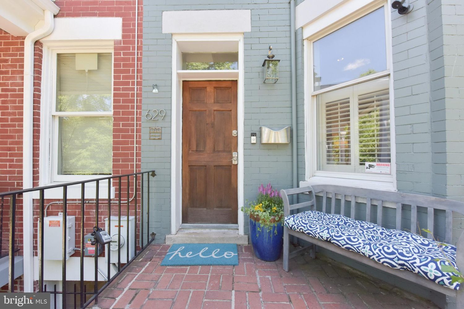 629 5th Street Northeast Washington, DC 20002 - Photo 2 of 31 a view of a porch with a chair and potted plants