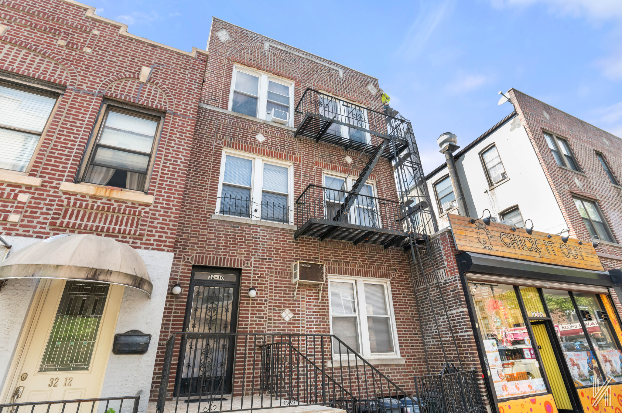 32-10 35th Street Queens, NY 11106 - Photo 2 of 29 a view of a brick building next to a yard